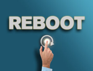 male hand pushing glowing reboot button, fresh start or new beginning concept reboot msp SafePoint IT